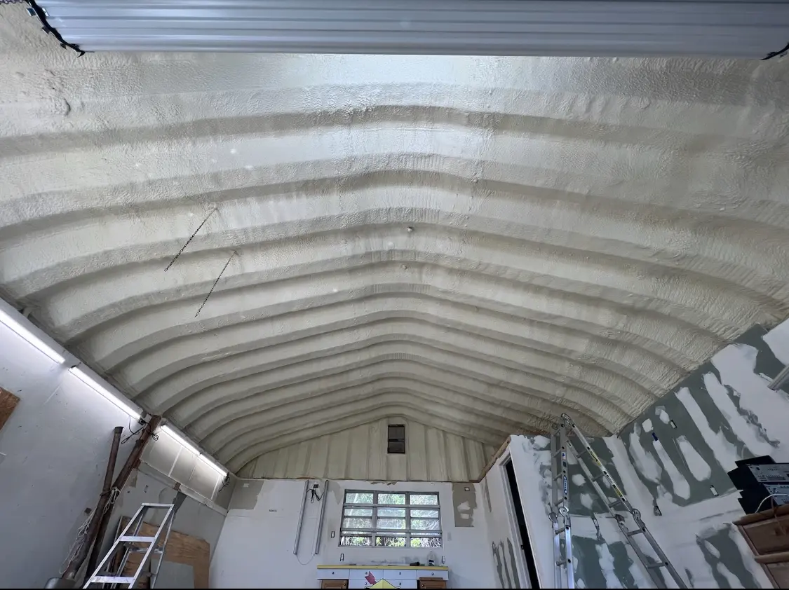 Spray polyurethane foam applied to the underside of a metal roof deck in Bainbridge